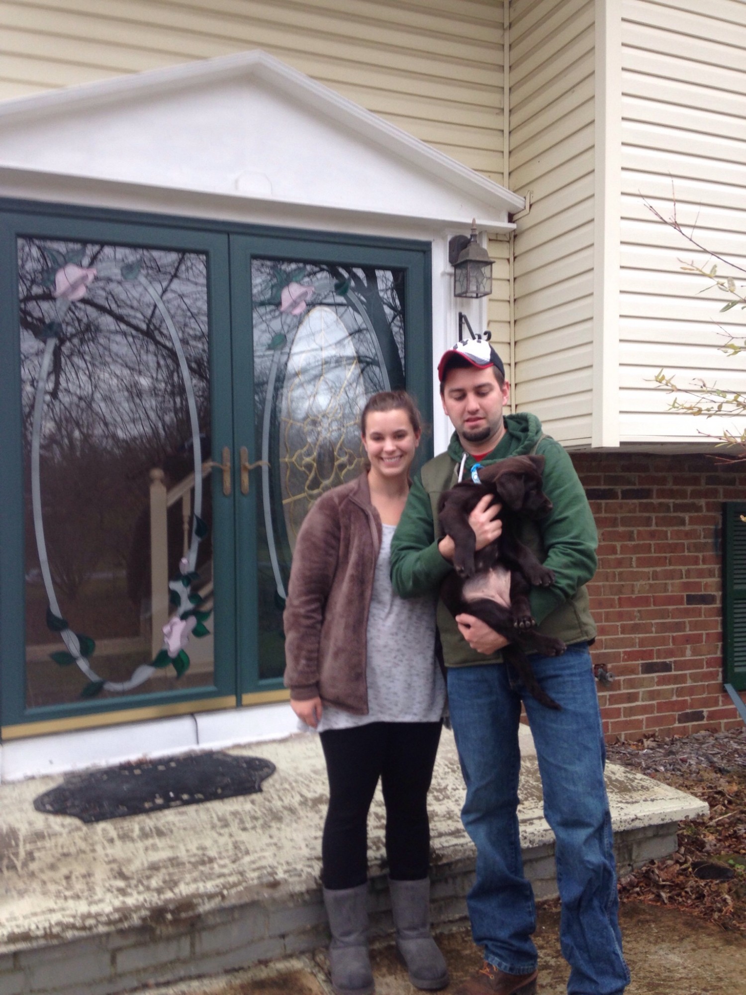 couple with dog, new owners